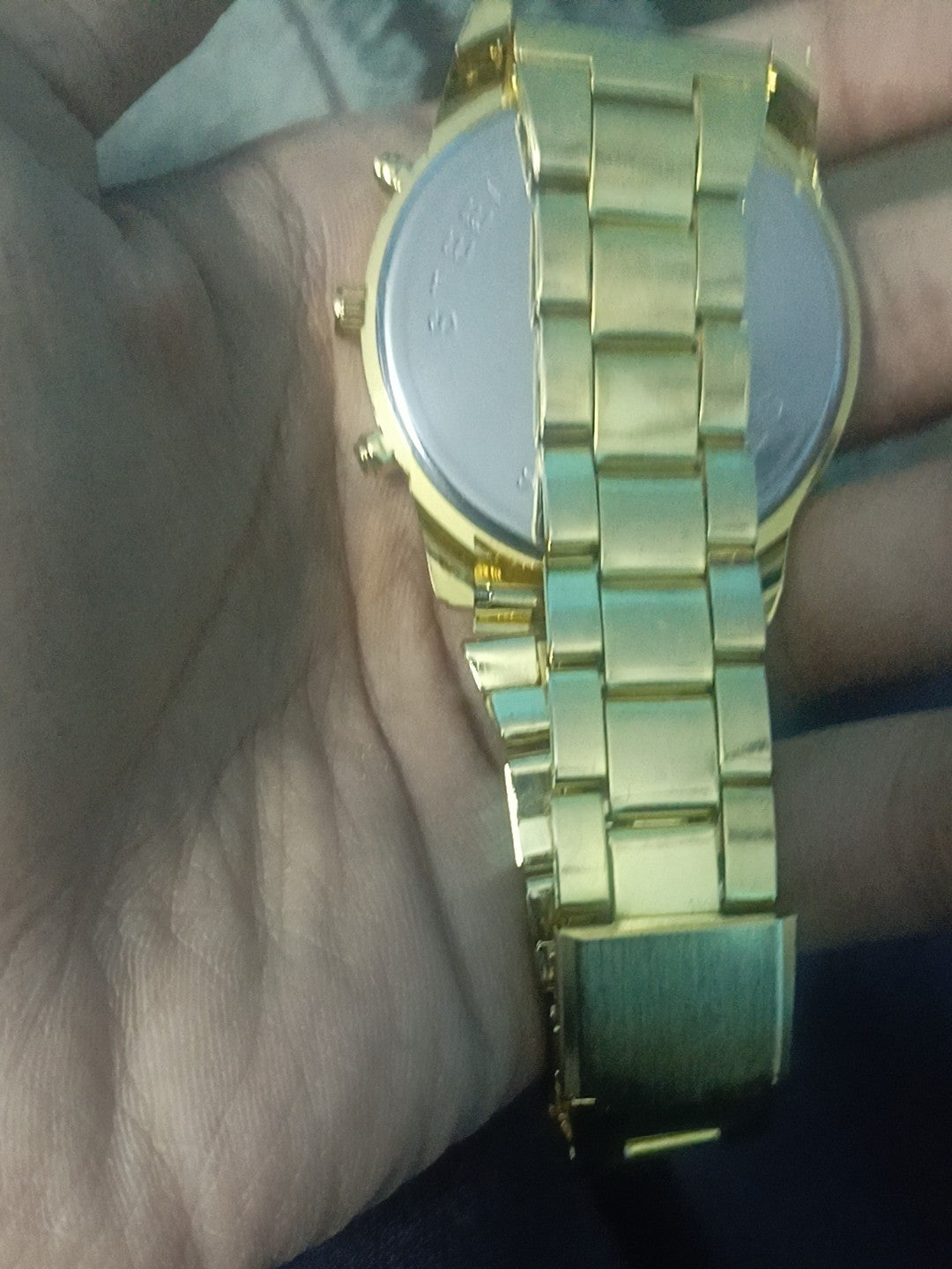 steel straps round dial wrist watch